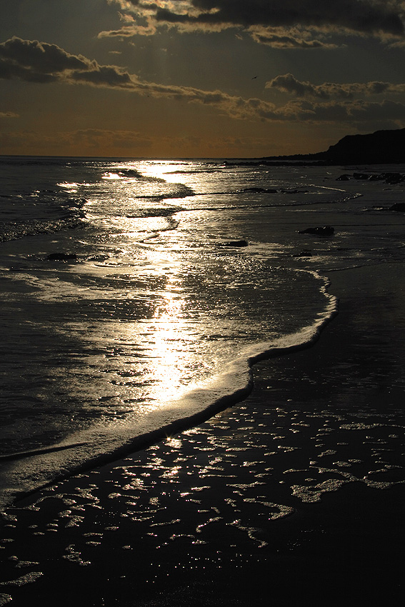 Sunset on the shore below Hastings Country Park